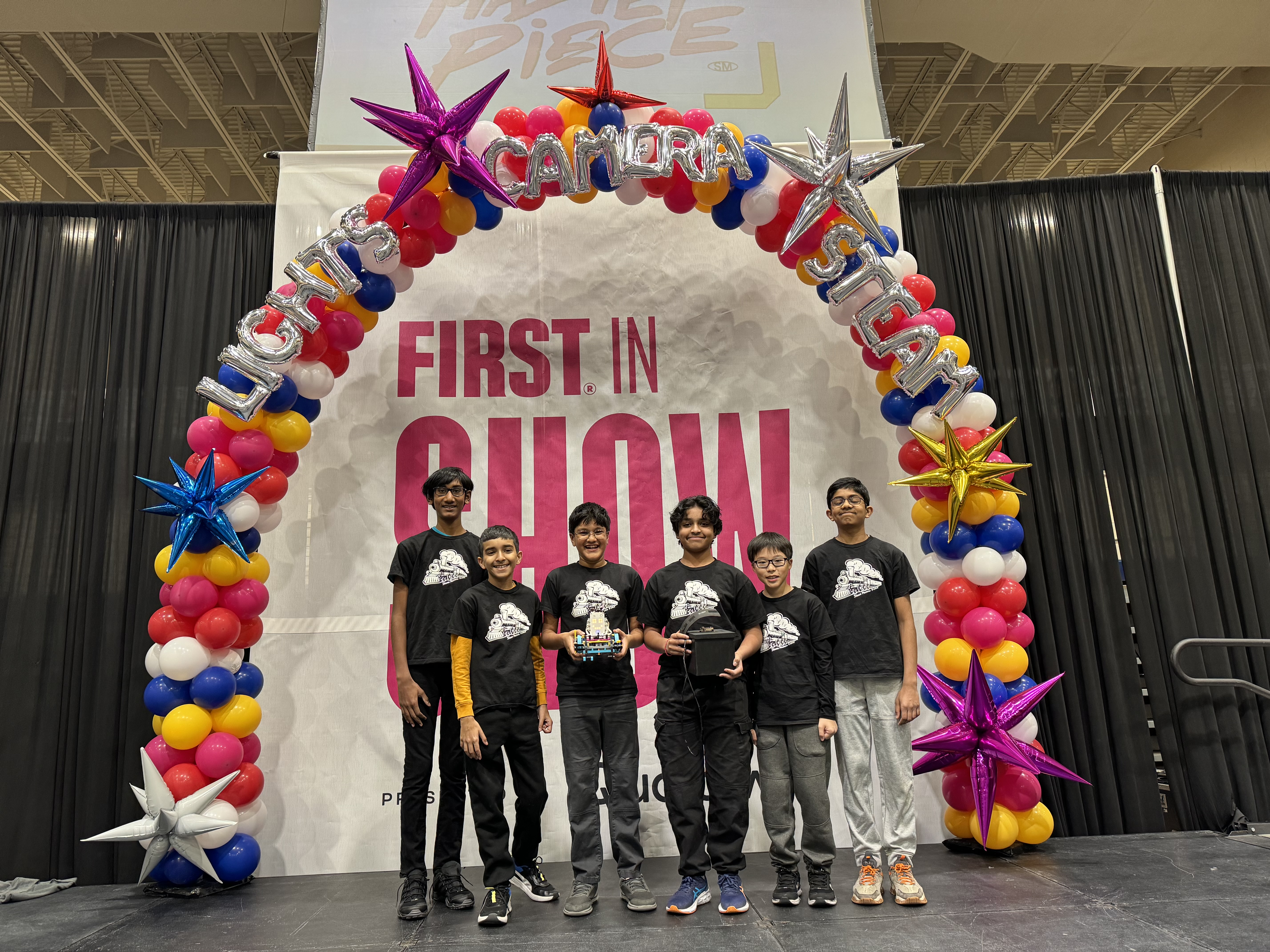 Robotics teams with shirts with train icon