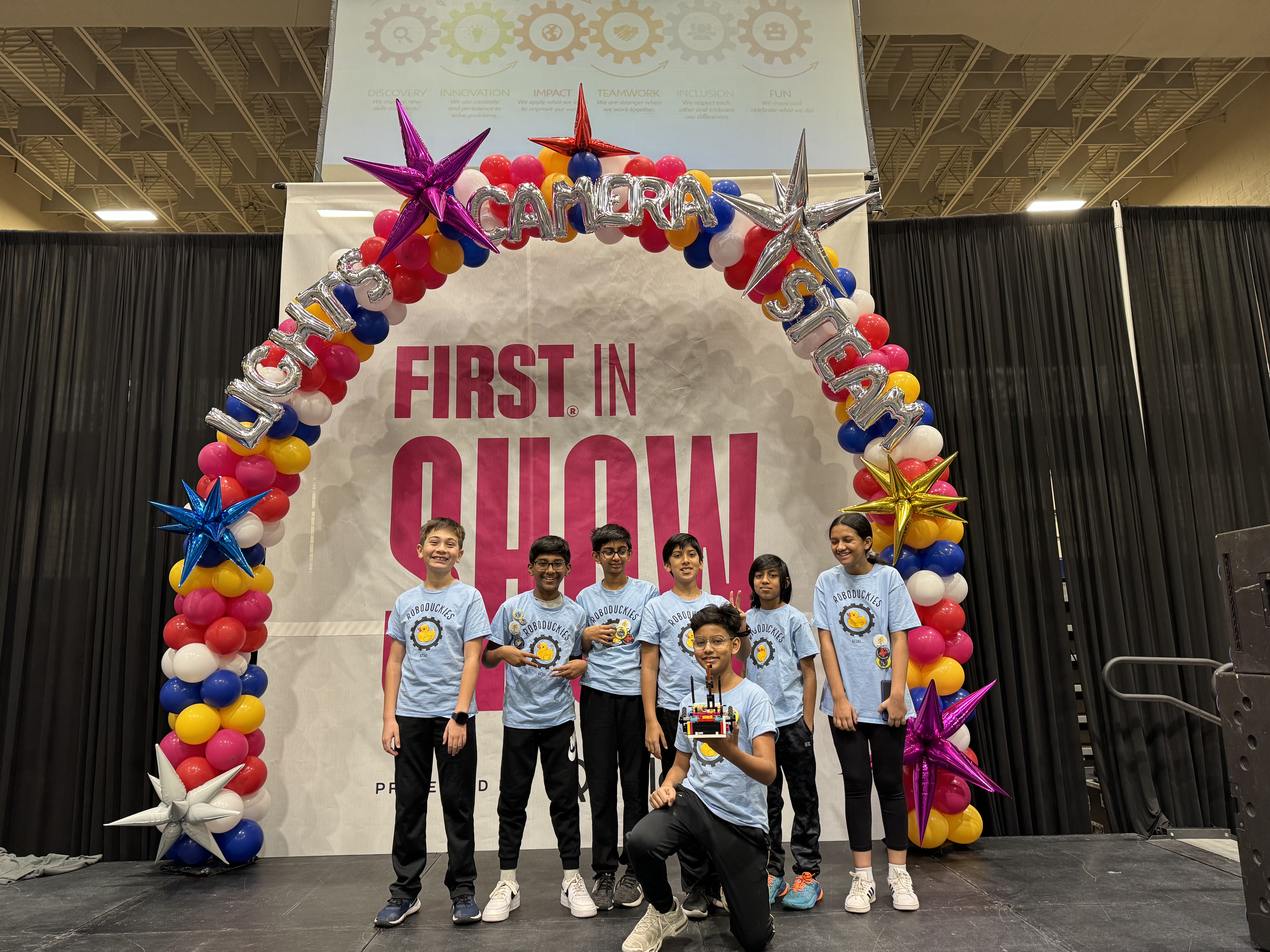 Robotics teams with shirts with duck icon